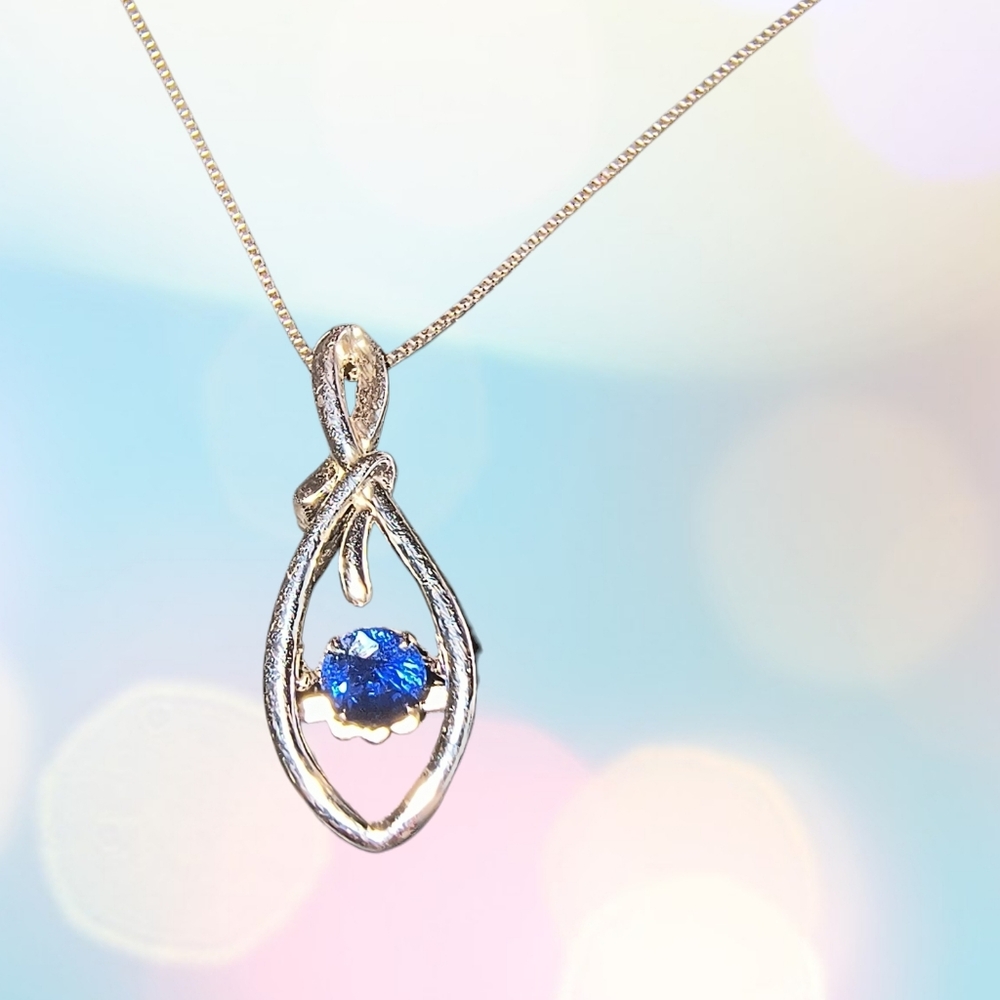 Floating Blue Sapphire In Sterling Silver Teardrop Setting
